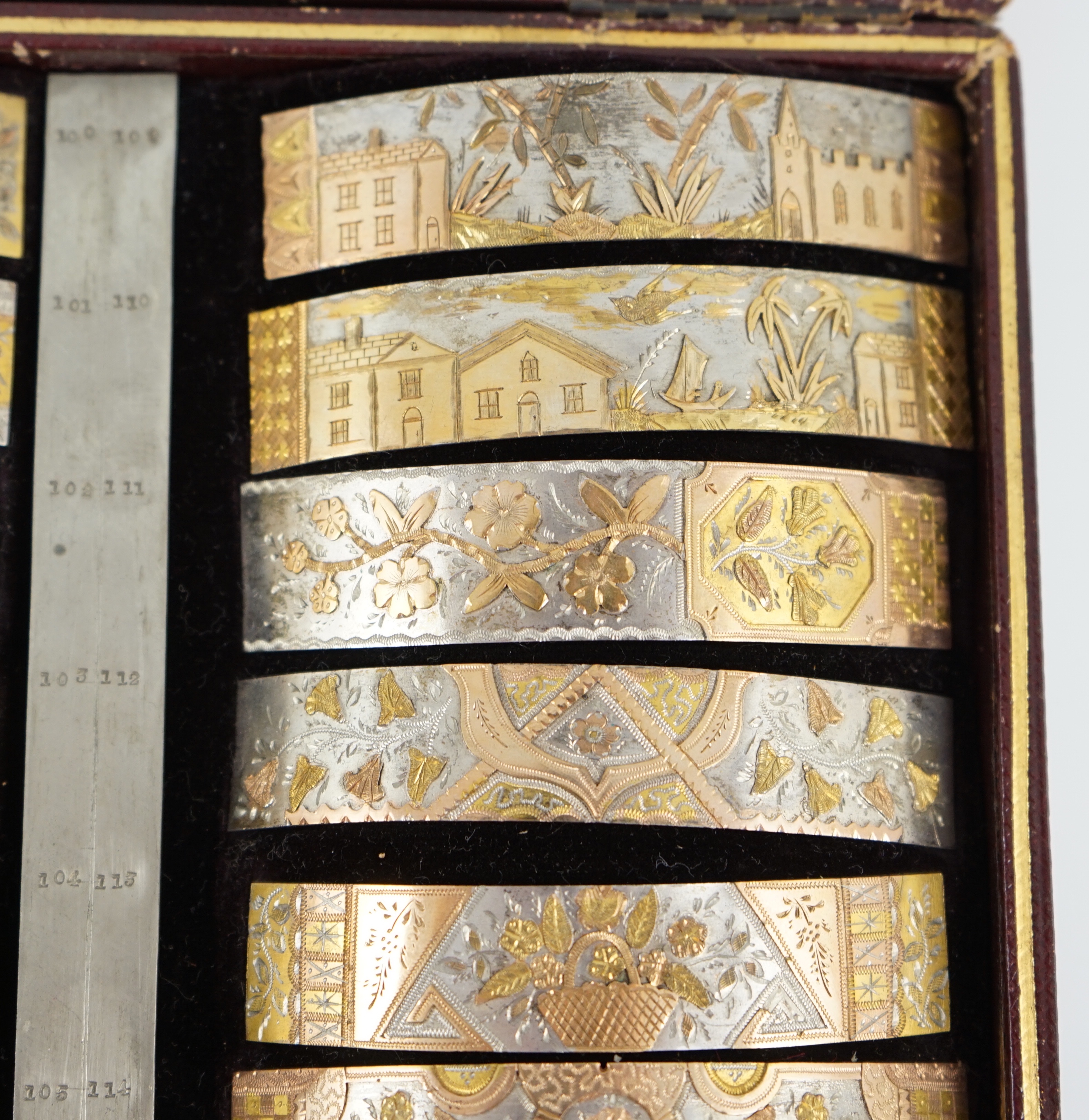 A Victorian cased travelling polychromatic metal bangle template set